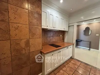 Charming kitchen with rustic tile accents and modern cabinetry