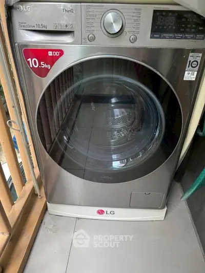 Modern LG washing machine on a balcony with sleek design and advanced features.