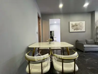 Modern living room with elegant dining area and stylish decor