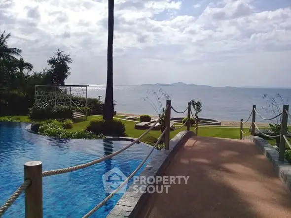 Stunning oceanfront view with pool and lush garden in luxury property
