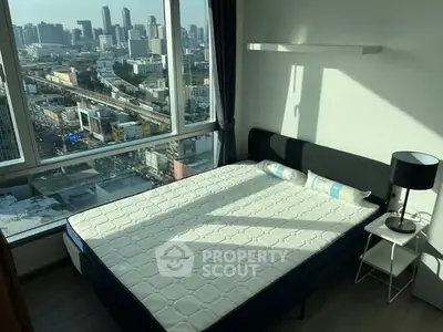 Modern bedroom with stunning city view and natural light