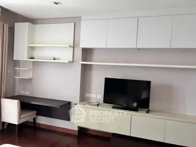 Modern living room with sleek TV unit and stylish shelving