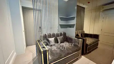 Modern living room with stylish sofa and mirrored wall design