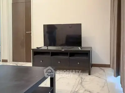 Modern living room with sleek TV stand and marble flooring