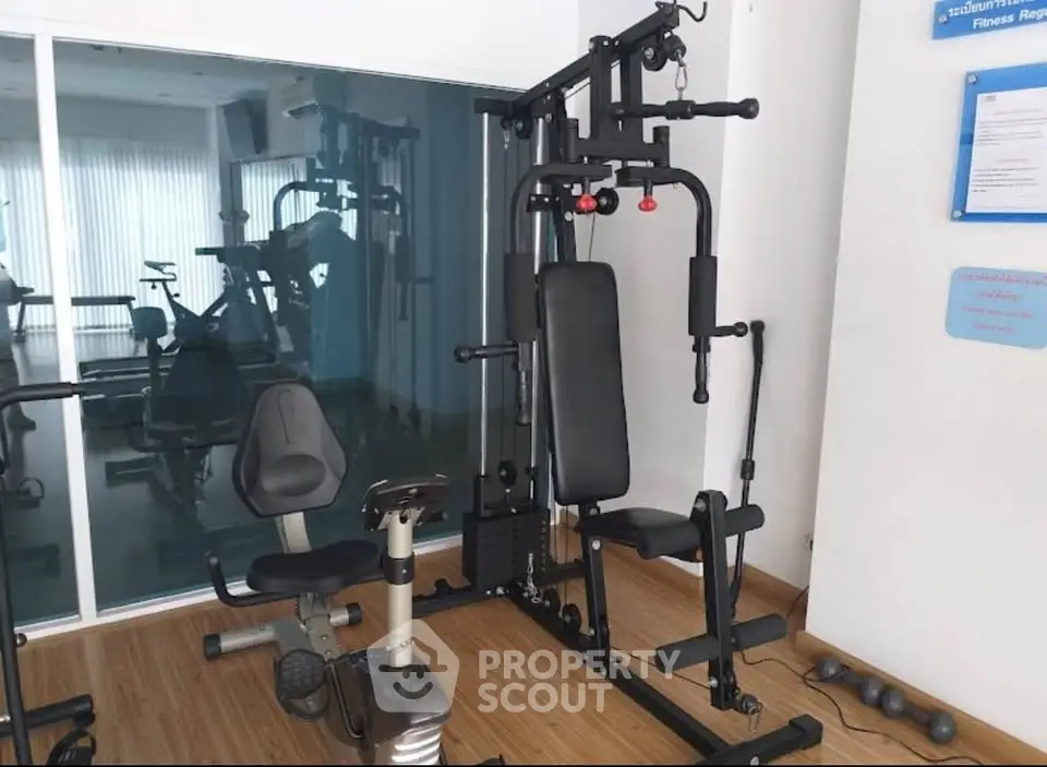 Modern gym with exercise equipment in a residential building