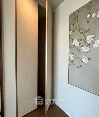 Elegant interior with hidden storage and floral wall art in modern home