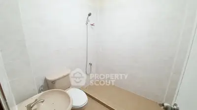 Minimalist bathroom with shower and toilet in a modern apartment