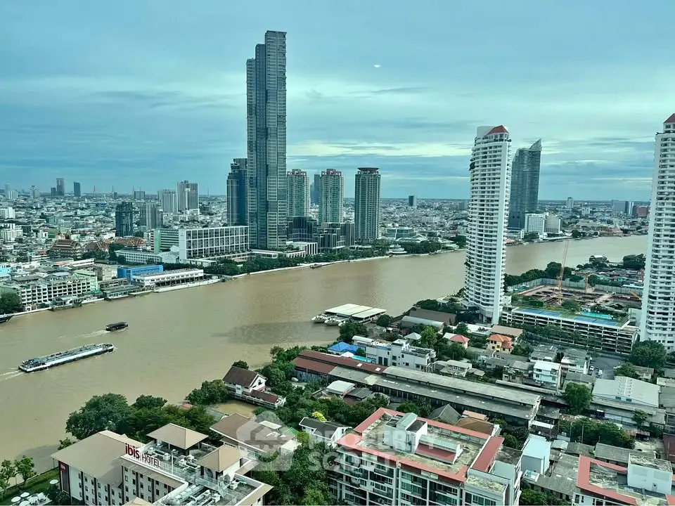 Stunning cityscape view with river and skyscrapers, showcasing urban living and architectural marvels.