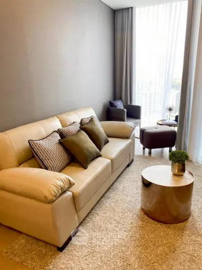 Elegant living room with cozy beige sofa and modern decor.