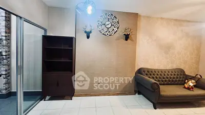 Stylish living room with elegant sofa and unique wall clock design