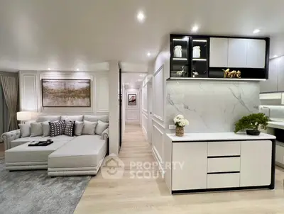 Luxurious modern living room with elegant decor and open kitchen layout, perfect for stylish urban living.