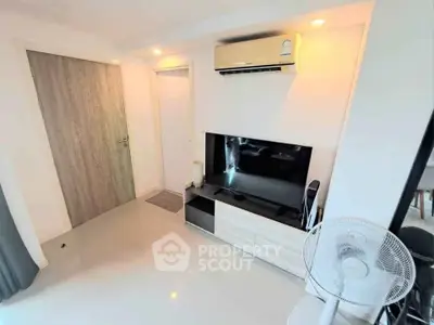 Modern living room with air conditioning and sleek TV setup