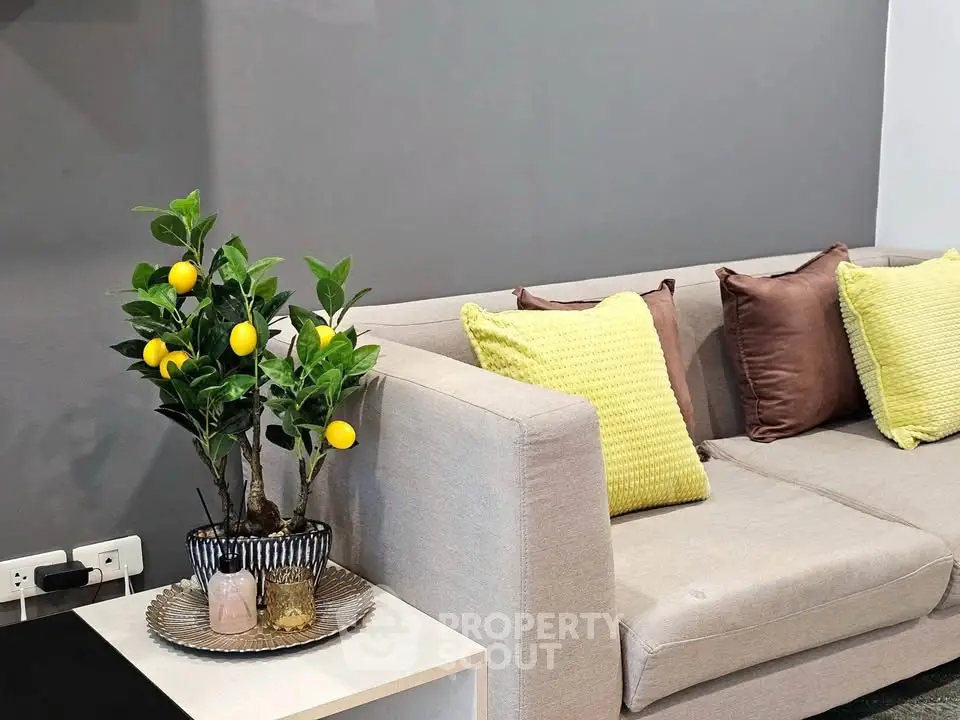 Stylish modern living room with cozy beige sofa and vibrant decor accents