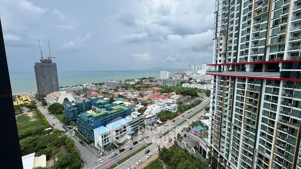 Stunning coastal cityscape view from high-rise building balcony