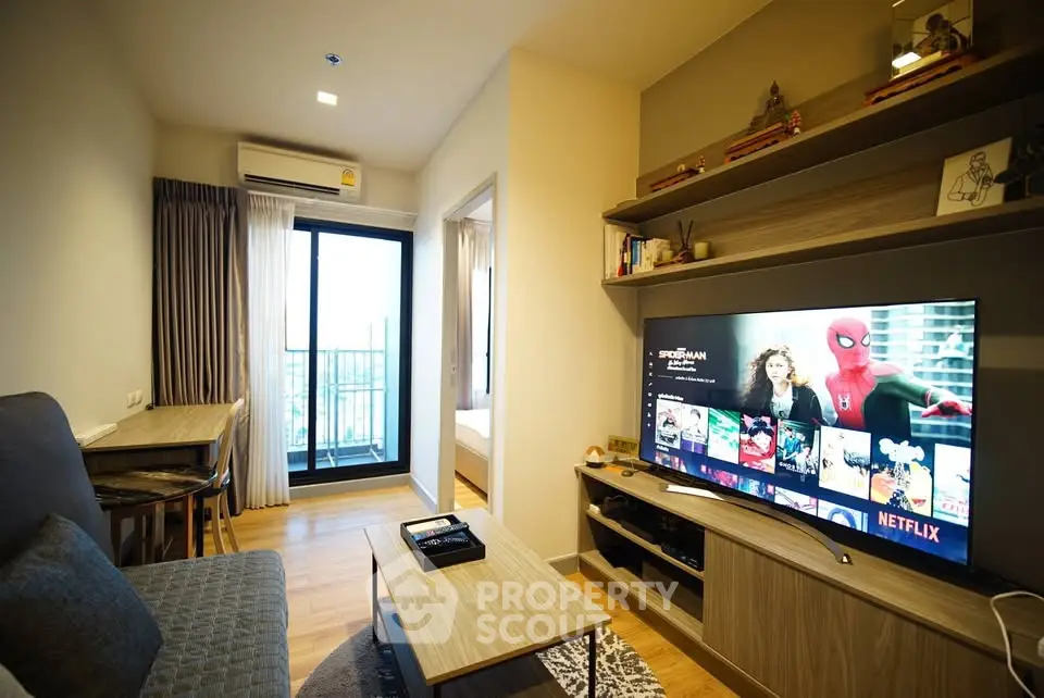 Modern living room with balcony view and entertainment setup