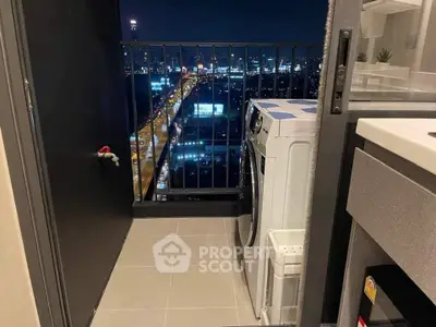 Chic urban balcony with city view and modern washing machine setup.
