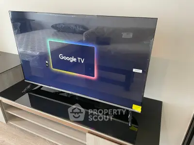Modern living room with sleek Google TV on stylish stand, perfect for entertainment enthusiasts.