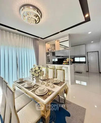 Luxurious dining area with elegant table setting and modern kitchen in open layout