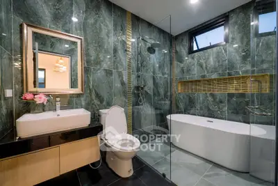 Luxurious modern bathroom with elegant marble walls and freestanding bathtub