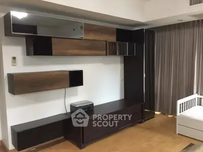 Modern living room with stylish wooden cabinets and sleek design