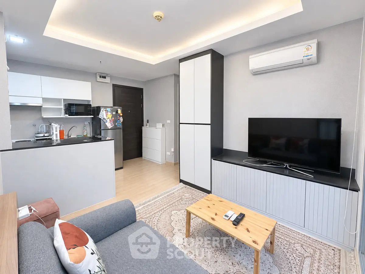 Modern living room with open kitchen and stylish decor