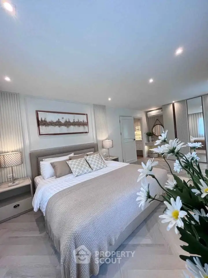 Luxurious bedroom with elegant decor and cozy bedding