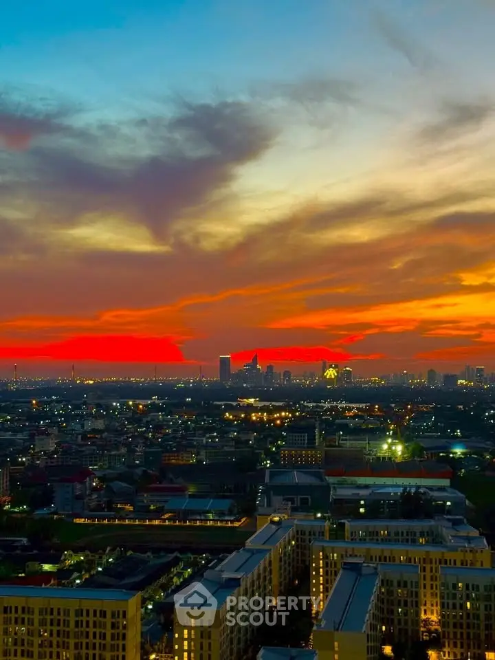 Stunning cityscape view at sunset with vibrant sky colors and urban skyline.