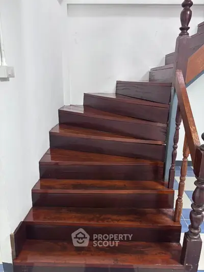 Elegant wooden staircase with polished finish in a modern home interior