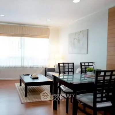 Charming living room with elegant dining area and natural light