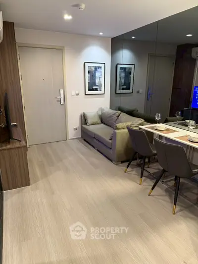 Modern living room with sleek dining area and stylish decor