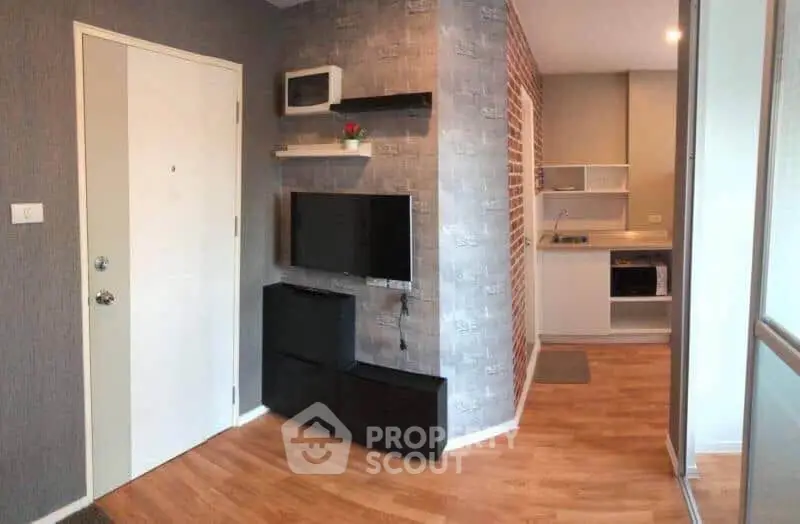 Modern apartment interior with stylish living area and compact kitchen