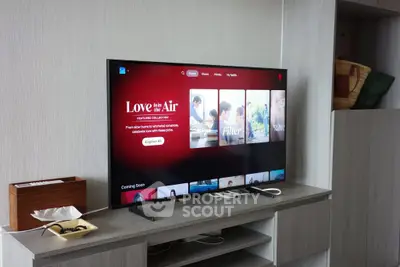 Modern living room with sleek TV setup and stylish shelving unit