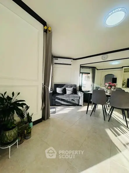 Bright and modern living room with stylish decor and ample natural light