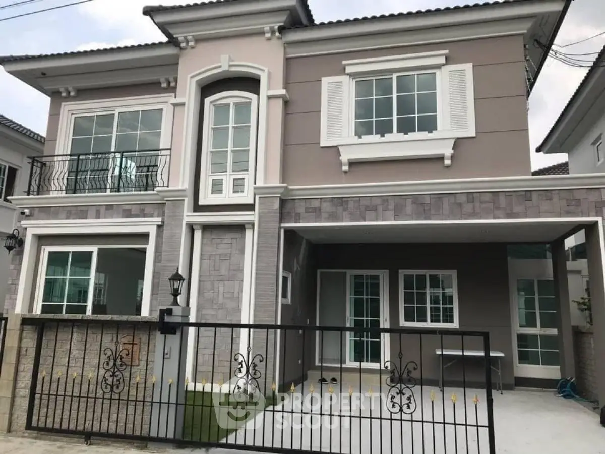 Elegant two-story house with modern facade and spacious driveway