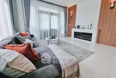 Luxurious living room with modern decor, cozy sofa, and elegant fireplace, perfect for relaxation and entertaining.