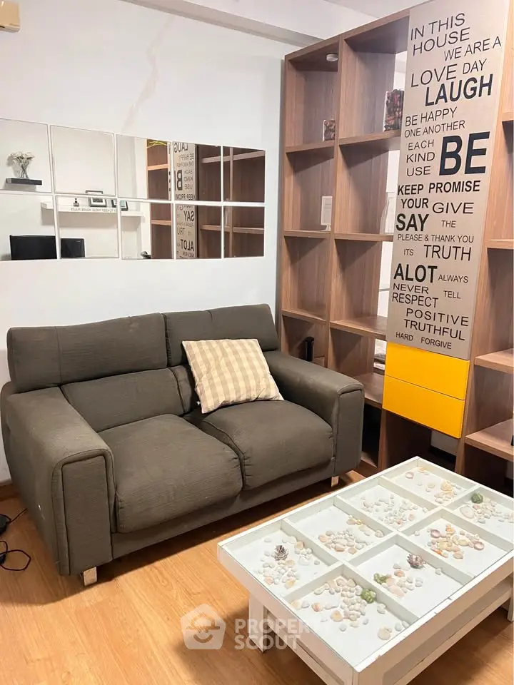 Cozy living room with stylish sofa and decorative shelving