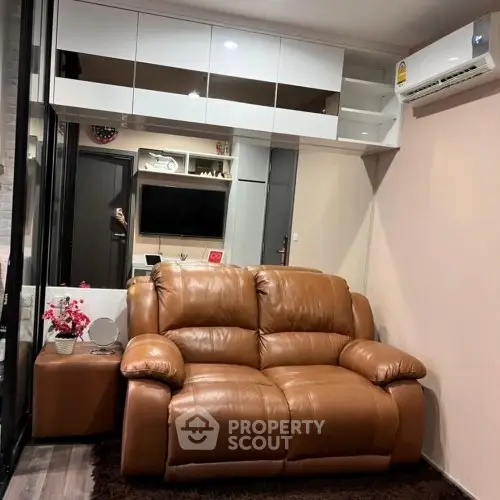 Cozy living room with leather sofa and modern decor