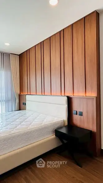 Modern bedroom with wood paneling and elegant design