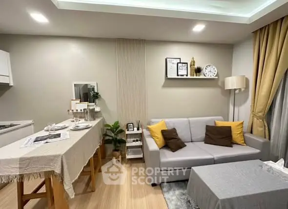 Modern living room with cozy sofa and stylish decor in a contemporary apartment.