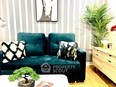 Stylish living room with plush sofa, chic decor, and modern accents