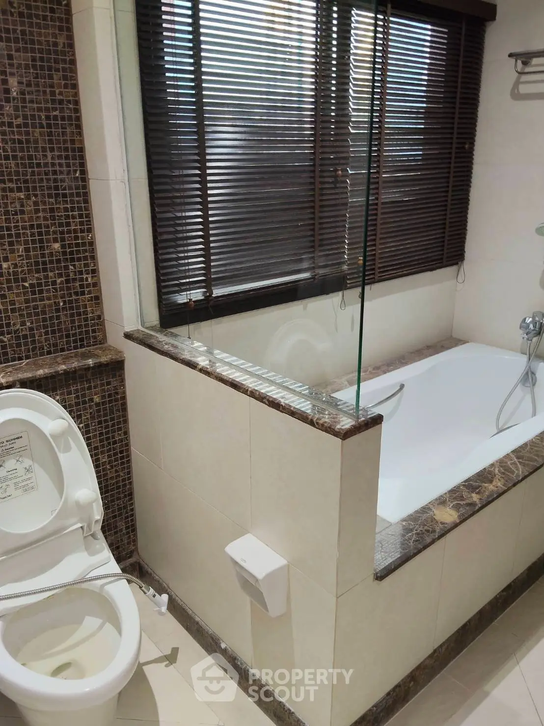 Luxurious bathroom with elegant bathtub and modern design features.