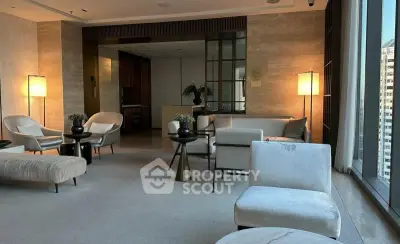 Luxurious modern living room with elegant furniture and large windows offering city views.
