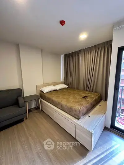 Modern bedroom with stylish decor and ample natural light