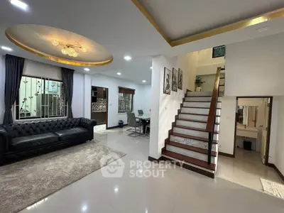 Spacious modern living room with elegant staircase and stylish decor