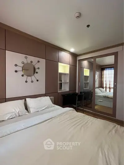Modern bedroom with stylish decor and built-in wardrobe