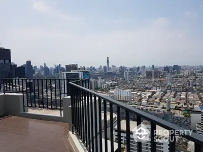 Stunning cityscape view from spacious balcony in high-rise apartment