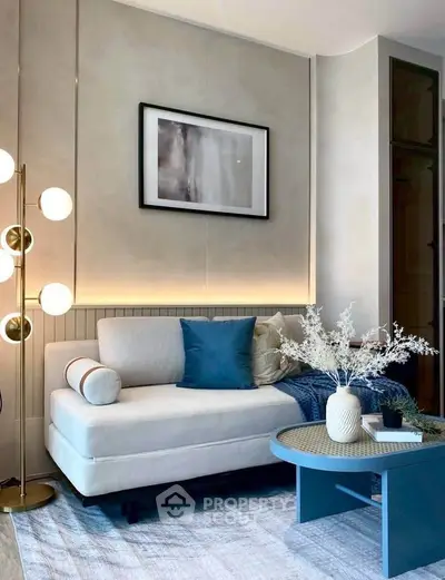 Stylish modern living room with elegant decor and cozy seating area.