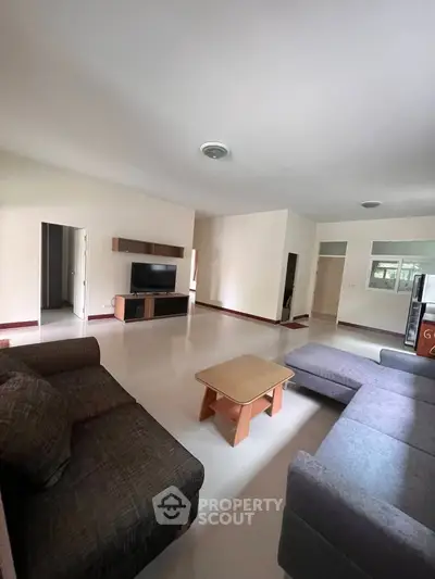 Spacious living room with modern furniture and sleek design