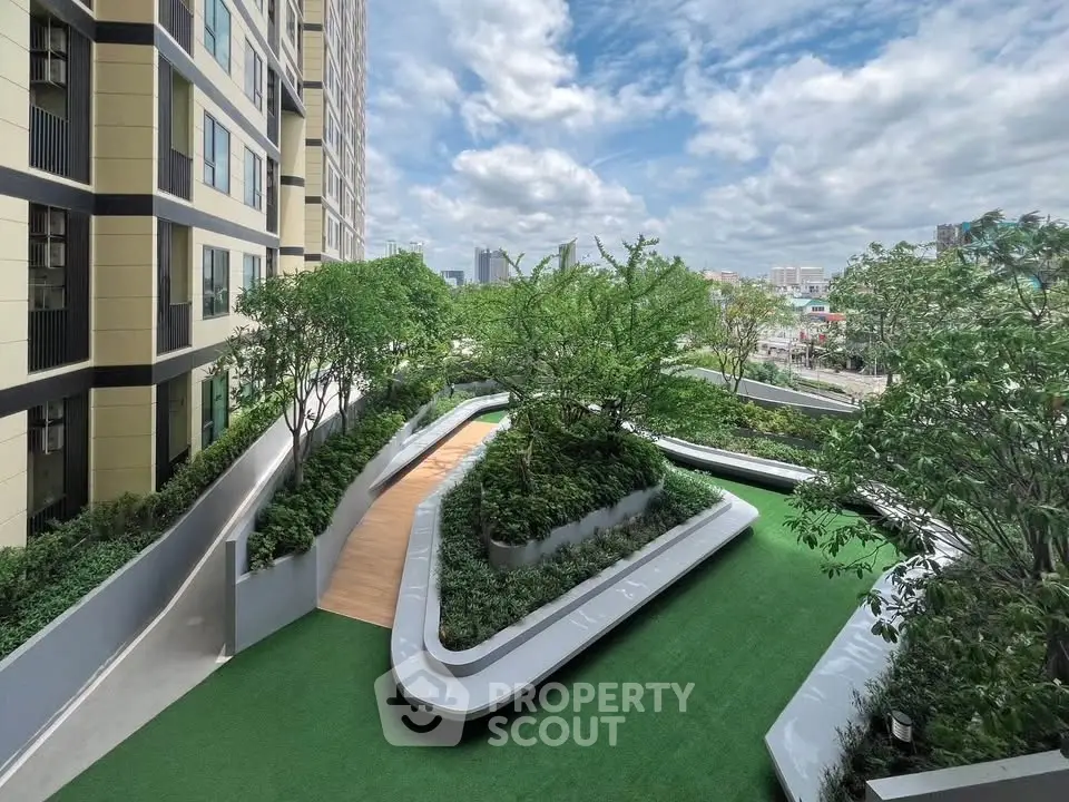 Stunning rooftop garden with lush greenery and city views in modern residential building.