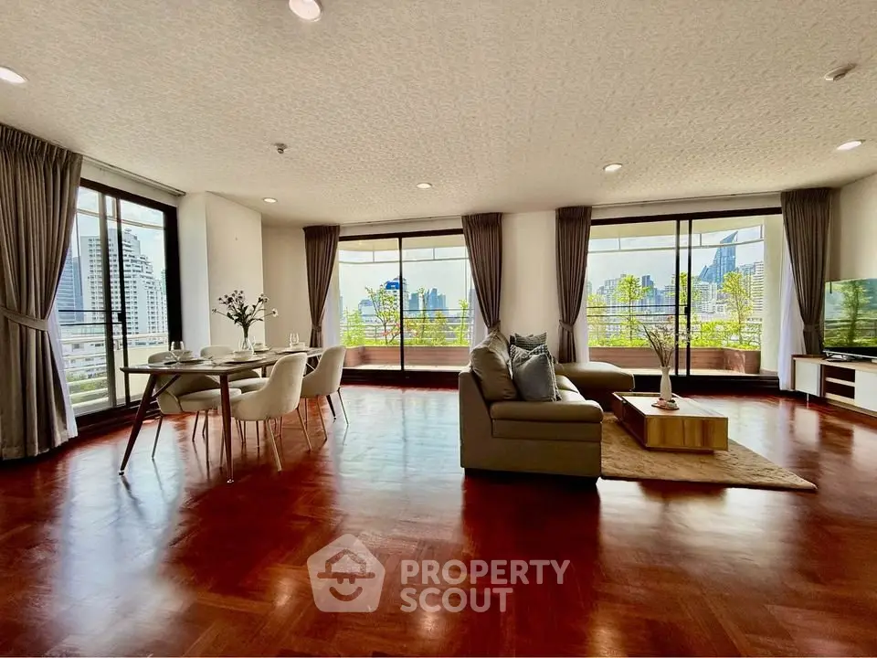 Spacious living room with city view and elegant decor in modern apartment